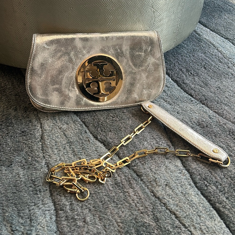 Gorgeous crackled metallic Tory Burch clutch with detachable strap.